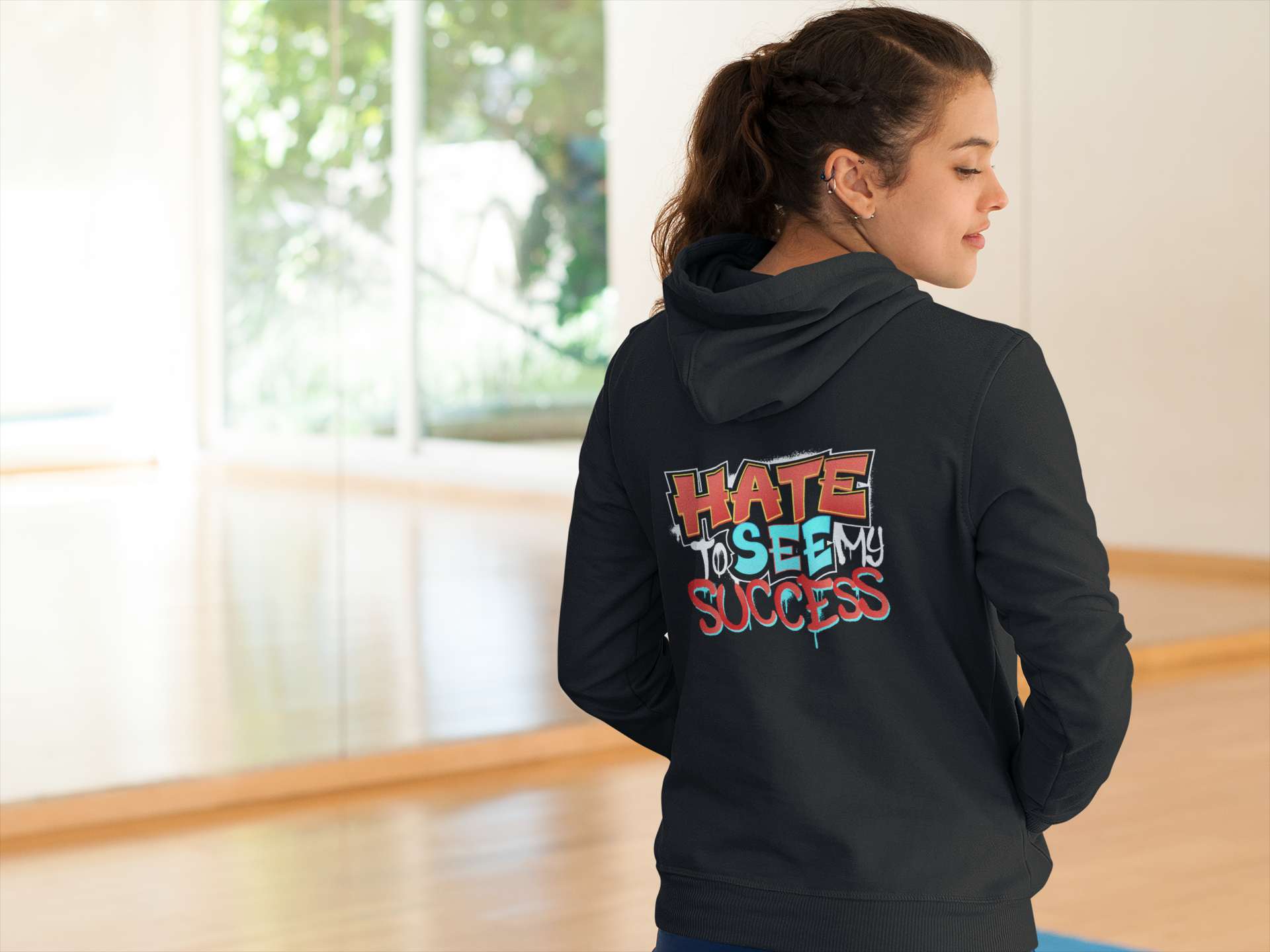 back-shot-of-a-woman-in-a-hoodie-at-a-yoga-class-a8617
