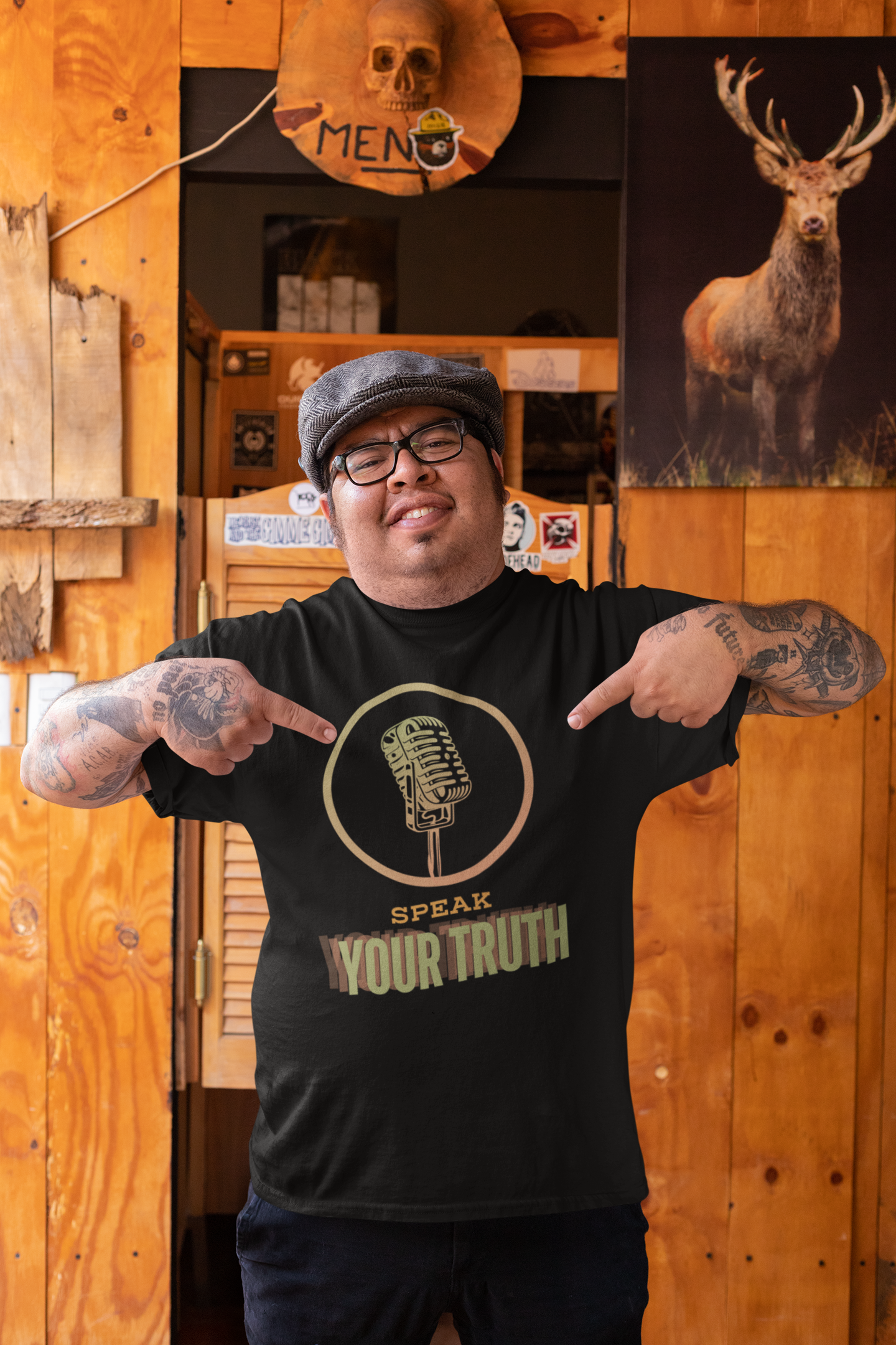 mockup-of-a-man-pointing-at-his-t-shirt-at-a-rustic-bar-32854