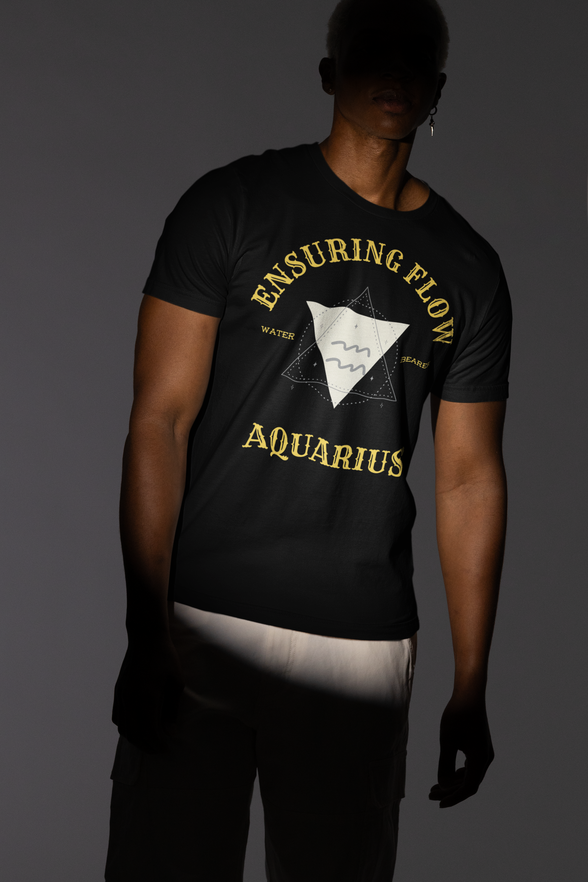 bella-canvas-tee-mockup-of-a-man-posing-under-a-spotlight-in-a-studio-m50030